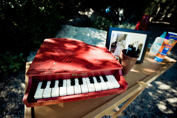 red mini piano serves as guestbook - music inspired DIY wedding - photos by top Orange County, CA wedding photographers Viera Photographics
